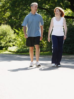 Mature couple exercising outdoors
