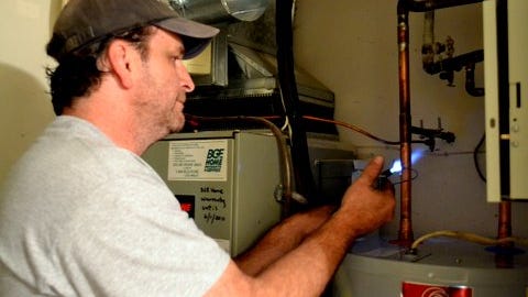 If your heater's not leaking or rusting or exploding, a good tuneup or repair might allow you to delay purchasing a replacement for another few years, especially if yours is relatively new.