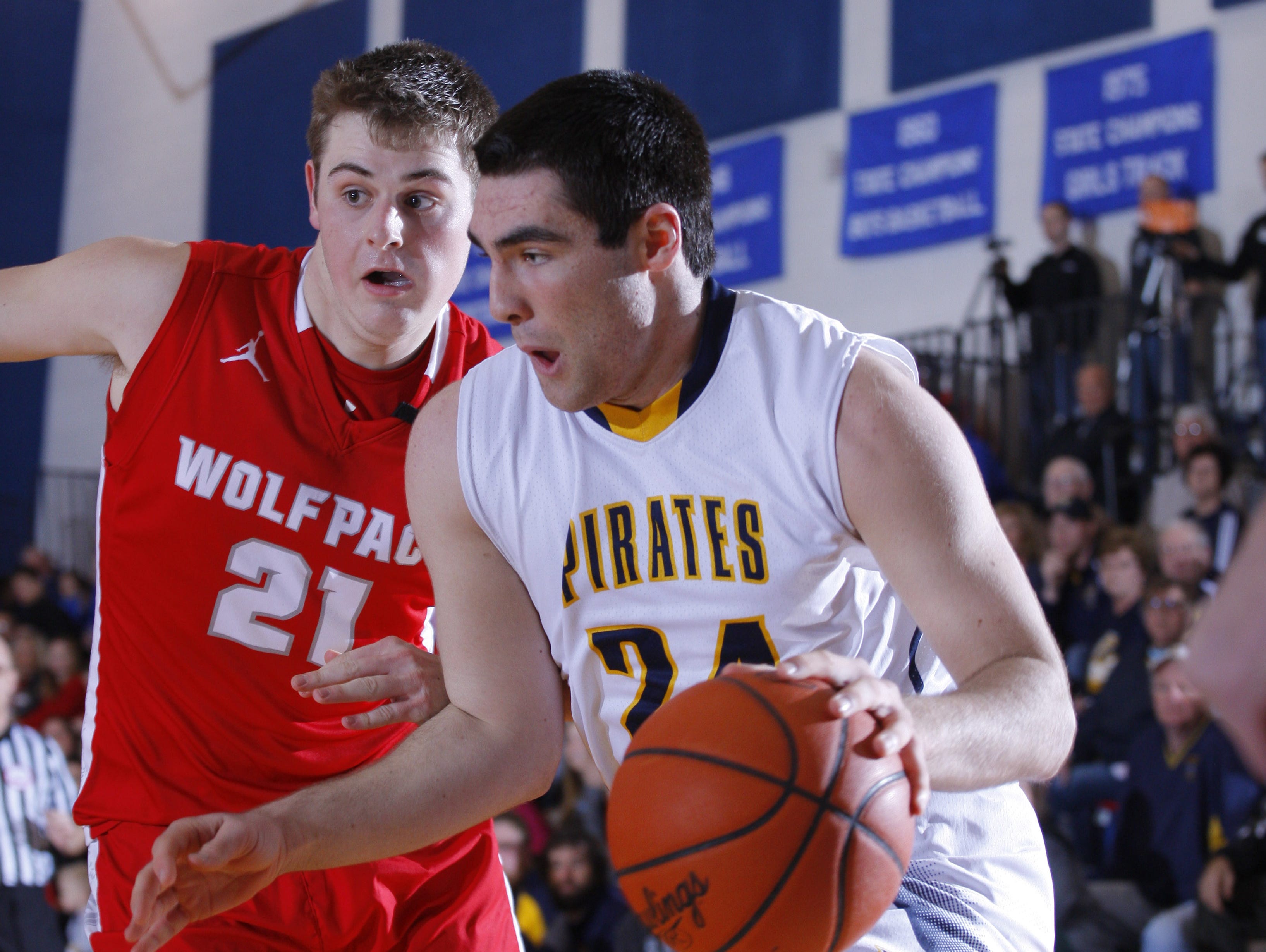 Pewamo-Westphalia's Bryce Thelen, right, drives against Laingsburg during their district semifinal game Wednesday, March 8, 2017, in Bath, Mich. P-W won 47-34.
