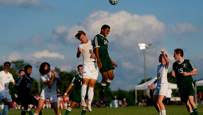 Greenville's Devin Elyze-Vital (25) heads a ball over Christian Presbyterian Academy's Owen Keck (6) during a class A-AA soccer game between Christ Presbyterian Academy and Greenville at the 2017 TSSAA Spring Fling state championships at Richard Siegel Soccer Complex in Murfreesboro, Tennessee on Wednesday, May 24, 2017.