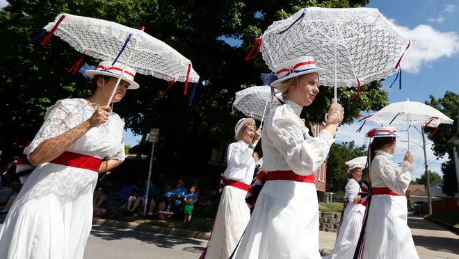 Members of the Midtown Victorian Ladies Drill Team march in Springfield's Old-Fashioned Fourth of July Parade in 2018.