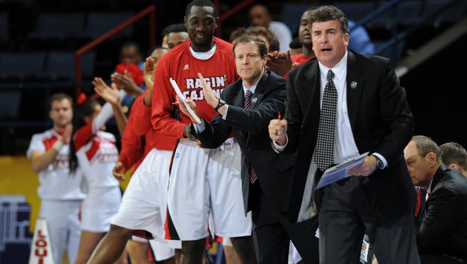 UL assistant coaches Gus Hauser, middle, is leaving the Cajuns' men's basketball program.