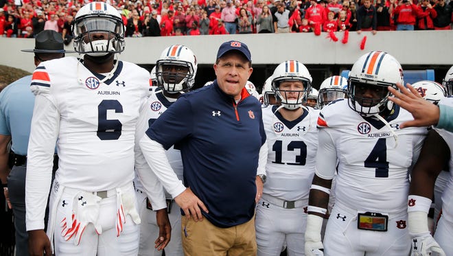 Jeremy Johnson stands side by side with Auburn head coach Gus Malzahn before the Tigers played Georgia last week.