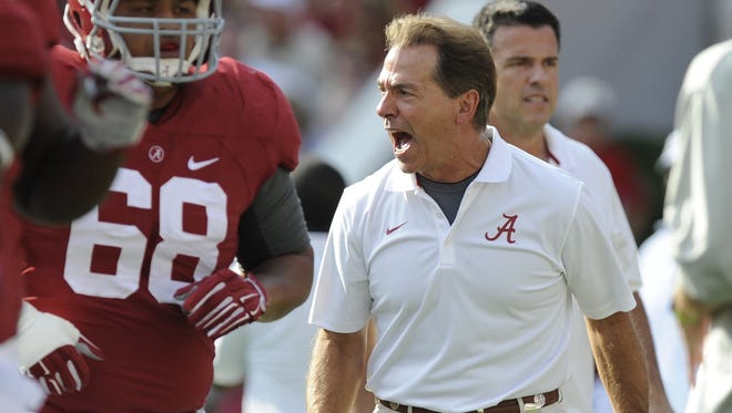 Alabama head coach Nick Saban and the Crimson Tide will open the 2015 season Sept. 5 against Wisconsin in Dallas.