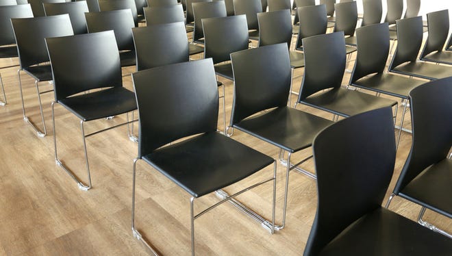 Empty chairs in a modern conference room