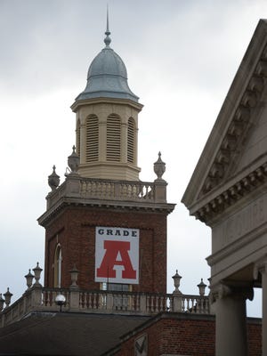 A banner with the letter grade A hangs on the bell tower at Richmond High School to promote the school's state accountability grade.