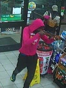 Robber enters 7-11.