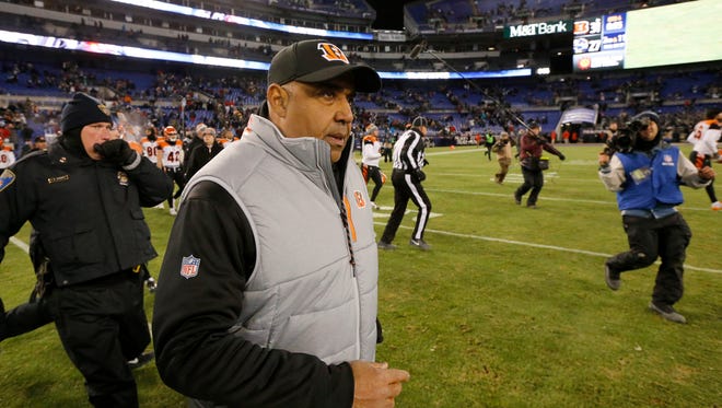 Cincinnati Bengals head coach Marvin Lewis takes the field to shake hands with Baltimore Ravens head coach John Harbaugh after the fourth quarter of the NFL Week 17 game between the Baltimore Ravens and the Cincinnati Bengals at M&T Bank Stadium in Baltimore on Sunday, Dec. 31, 2017. The Bengals won 31-27 in the regular season finale. 