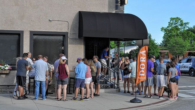 Patrons enjoy a Designated Outdoor Refreshment Area event, known as DORA, on June 14, 2018, outside Sports on Tap in Old Hilliard. Canal Winchester City Council has been considering a DORA but appears likely to to forgo the idea for the time being.