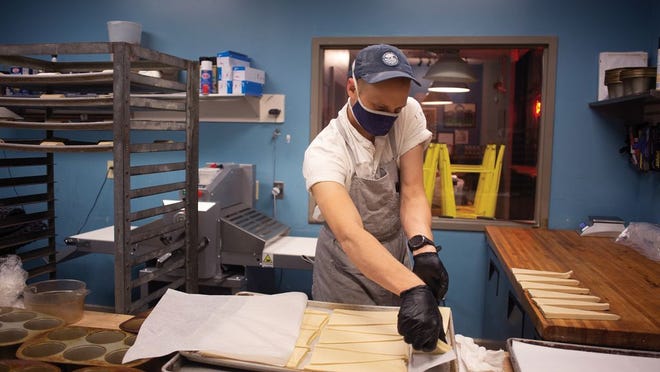 Daniel Riesenberger, known as Dan the Baker, prepares croissants in his Grandview bakery.