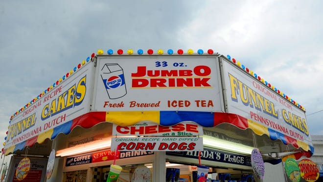 A food vendor at a previous Monroe County Fair is shown in this Monroe News File Photo. Food has always played a huge role in the beloved fair, however there are some fair foods you can make in your very own kitchen all year long.