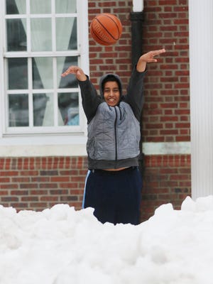 Even with snow surrounding the court, Rafat Saada 15 of Clifton came out in the cold to shoot baskets on the asphalt court at Clifton Elementary School 1.