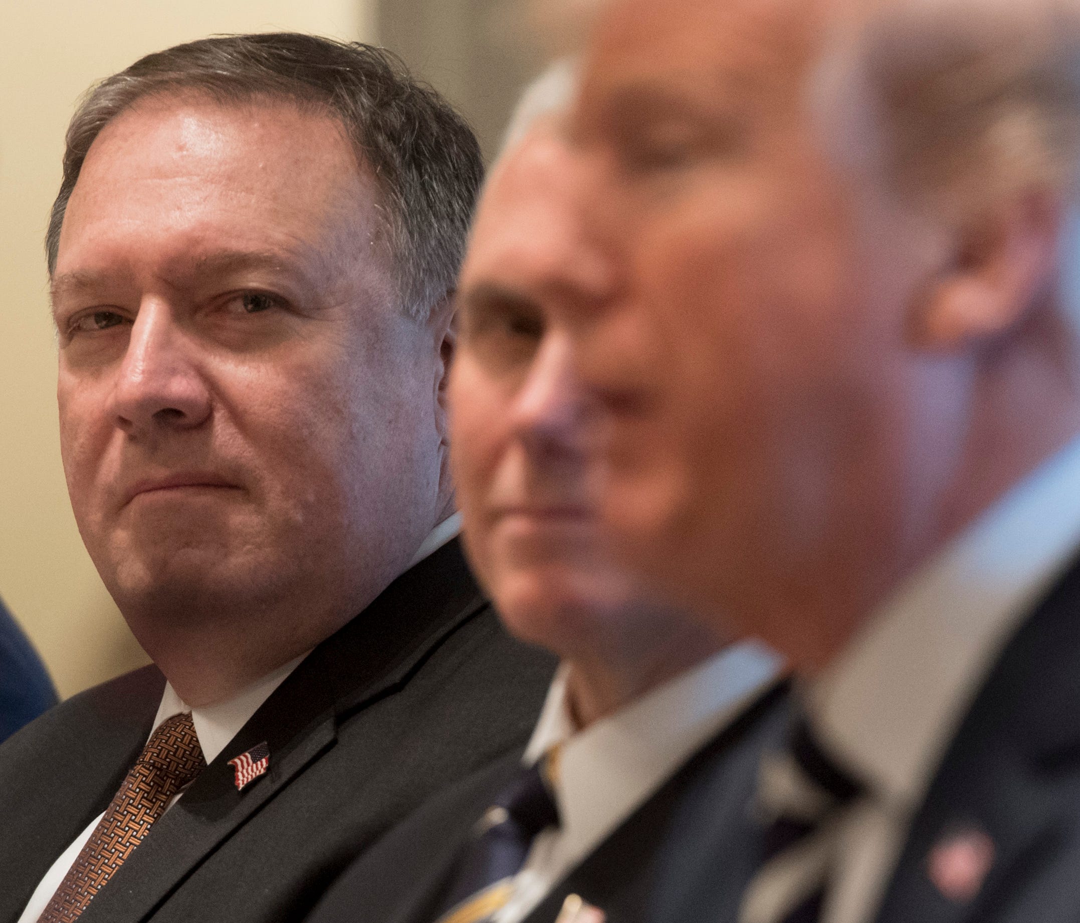 CIA Director and Secretary of State nominee Mike Pompeo (L) attends a lunch meeting with President Trump (R) and Saudi Arabia's Crown Prince Mohammed bin Salman, and members of his delegation, in the Cabinet Room of the White House in Washington, DC,