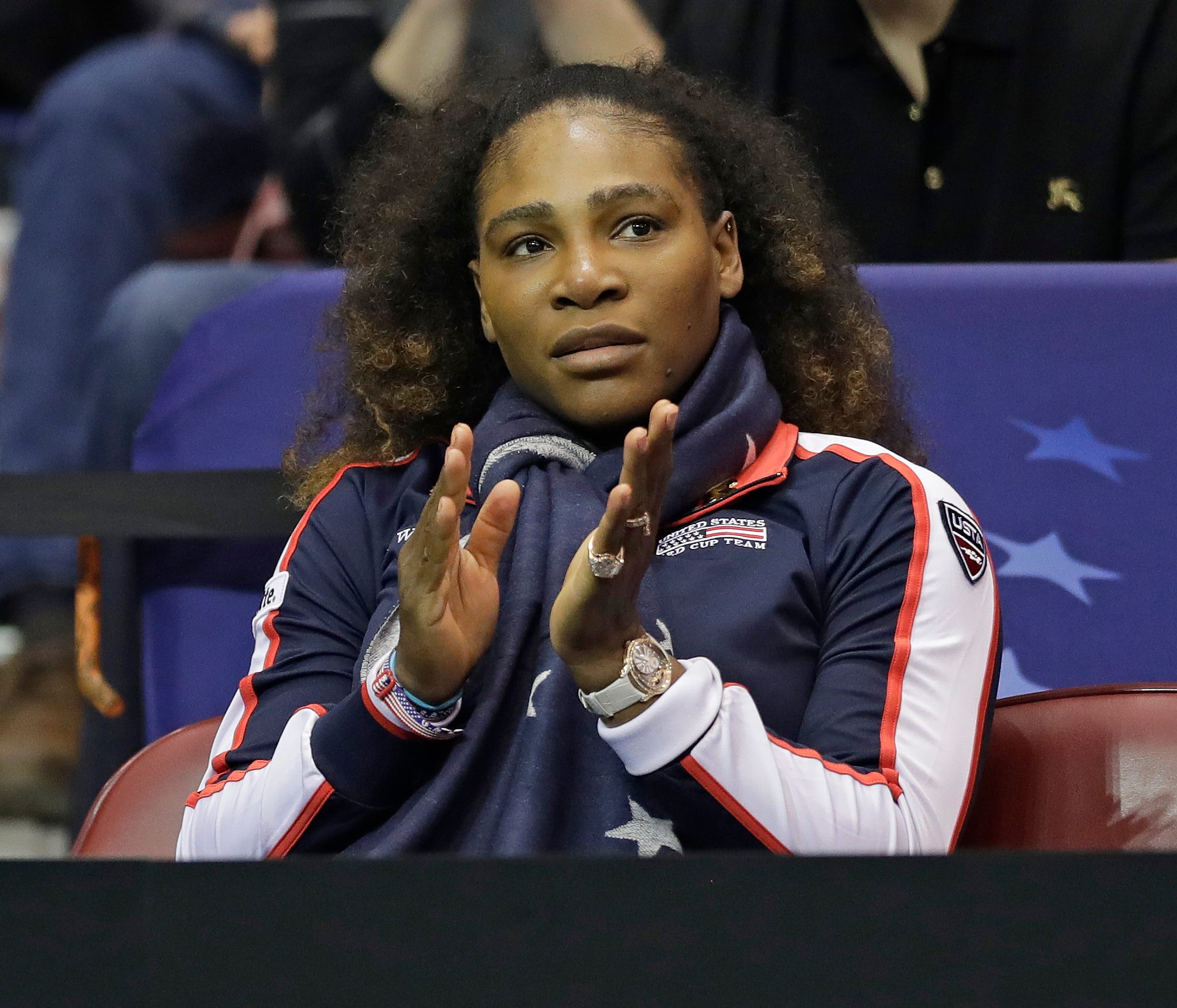 USA's Serena Williams cheers on Venus Williams against Netherlands' Arantxa Rus during a match in the first round of Fed Cup tennis competition in Asheville, N.C., Saturday, Feb. 10, 2018. (AP Photo/Chuck Burton) ORG XMIT: NCCB112