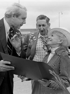 Famed burlesque dancer and actress Sally Rand, right is welcome to Nashville by an Chamber of Commerce official as she arrives at Nashville Municipal Airport May 1, 1975. Looking on is Skull Schulman, center, who will have the 71-year-old dancer performing at his Rainbow Room in Printers Alley.