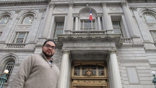 Juan Hernandez, seen here outside Hartford City Hall, and his girlfriend pay $1,600 a month to rent a one-bedroom apartment in Hartford, Conn.