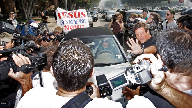A 2007 photo showing Britney Spears surrounded by paparazzi as she arrived at a court hearing in Los Angeles.