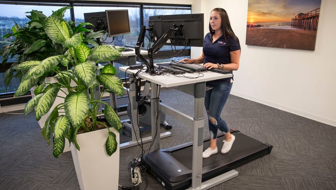 Due to the health hazards of sitting for long periods of time, companies are starting to utilize treadmill and standing desks in the workspace. Amanda Hulse, an employee of Wayside Technology, uses the treadmill desk often while working. Eatontown, NJWednesday, February 7, 2018@dhoodhood 