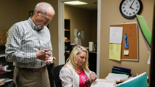Dr. William Fannin, left, and office manager Amy Hunt work in the office at the Eastern Kentucky Rehabilitation Center in Prestonsburg, Kentucky. Fannin, practicing medicine in the area for 31 years, has watched the evolution of the opioid epidemic in eastern Kentucky over the last three decades. He lost his son, Sean Fannin, at the age of 27 to an overdose of opioids and benzodiazepines. "If nothing else, it helped me to truly understand this is a disease process. It's not a lack of moral fiber, self control, or strength. It's a disease," Dr. Fannin said. Fannin believes that the current epidemic began in the late 1990s. "We started looking at pain as the fifth vital sign," Fannin said. "Oxycotin, primarily, was heavily marketed and with what I thought was disengenuous presentations of pain management. It really ushered in a time where physicians were more comfortable prescribing opioid medications." Today, Dr. Fannin works at the Eastern Kentucky Rehabilitation Center in Prestonsburg, Kentucky, using Vivitrol and Suboxone treatments alongside psychological non-drug treatments to help curb addiction. "If you look at all the opiod prescriptions that are legitimately written by subsribers on planet earth, 85 percent of them are within the continental United States. Do we really experience that much more pain?" Nov. 7, 2017