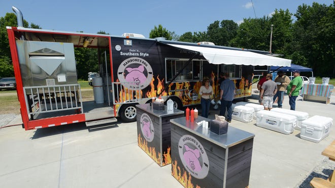 
Customers visit Hambone’s BBQ on July 11. The food truck held its grand opening July 10 on South Highland Avenue in Jackson. 
