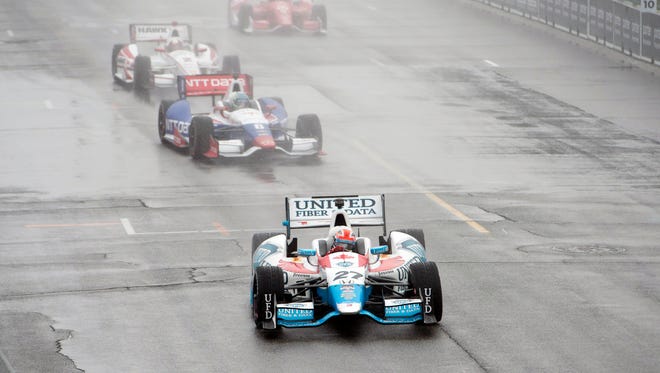 Canada's James Hinchcliffe (27) drives under a yellow caution flag.