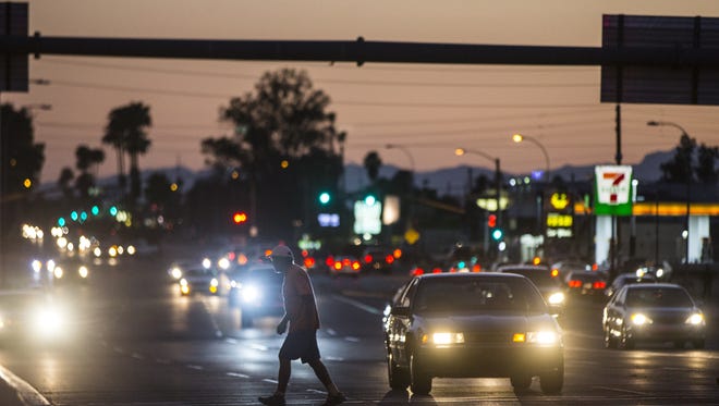 People make their way through an intersection near I-17 and Indian School Road June 25, 2016 in Phoenix, Ariz. In the past several years, the cross-section has drawn more concentrated crime more consistently than other areas in the valley.