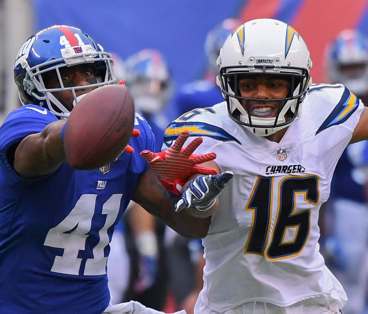 Los Angeles Chargers wide receiver Tyrell Williams (16) and New York Giants cornerback Dominique Rodgers-Cromartie (41) fight for a pass in the second half, falling incomplete at MetLife Stadium.