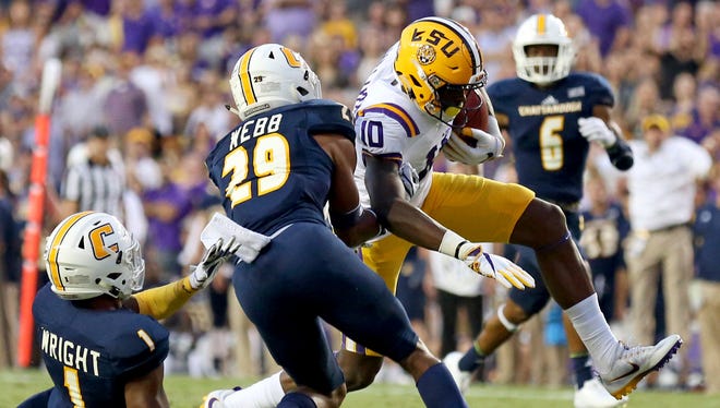 LSU wide receiver Stephen Sullivan (10) comes down with a 57-yard pass reception as Chattanooga defensive back Trevor Wright (1) and defensive back Lucas Webb (29) cover during the first half of an NCAA college football game in Baton Rouge, La., Saturday, Sept. 9, 2017.
