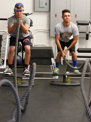 Alexander Briggs and Andrew Miranda, both Canutillo High School students, work out at IronWorks Gym at Fort Bliss. The two are among seven area high school students that were recently named All-Americans by the National Strength and Conditioning Association (NSCA) for their strength training over the past two years. Four other All-Americans are from Canutillo High School and one from Coronado High School.