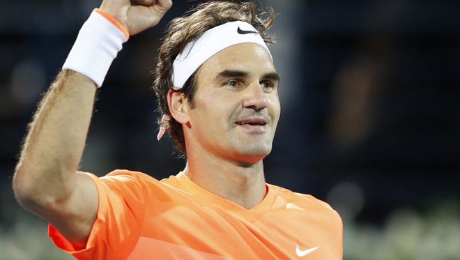 Roger Federer of Switzerland celebrates winning the final match against Novak Djokovic of Serbia at the Dubai Duty Free Tennis ATP Championships in Dubai.