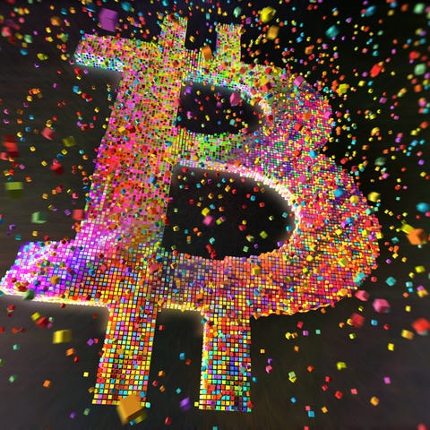 Bitcoin symbol made up of colored spheres.