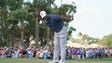 Tiger Woods reacts after missing a putt on the 3rd