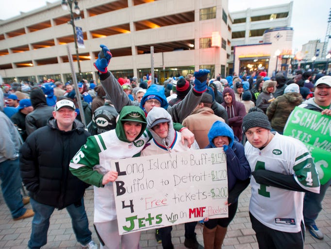 Jets and Bills fans mug for the camera while waiting