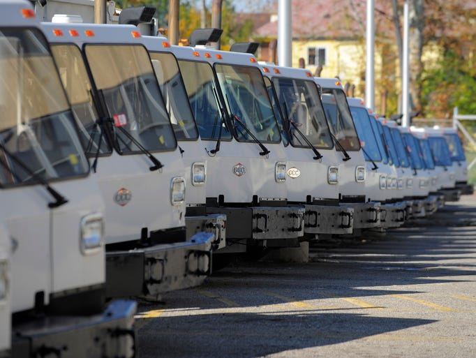 Surplus vehicles, including garbage trucks, are stored