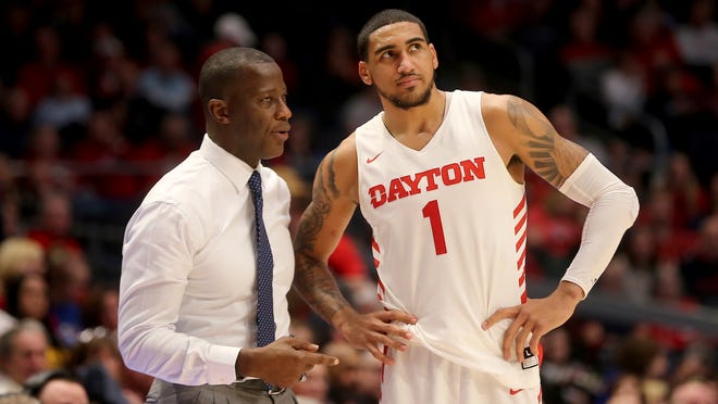 Dayton head coach Anthony Grant, left, talks with Obi Toppin during the second half of an NCAA college basketball game against Fordham, Saturday, Feb. 1, 2020, in Dayton, Ohio. (AP Photo/Tony Tribble)