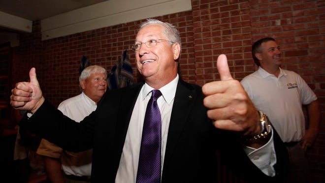 Greene County Presiding Commissioner candidate Bob Cirtin gives two thumbs up as election results begin to come in in his favor at a watch party on Tuesday, August 5, 2014.