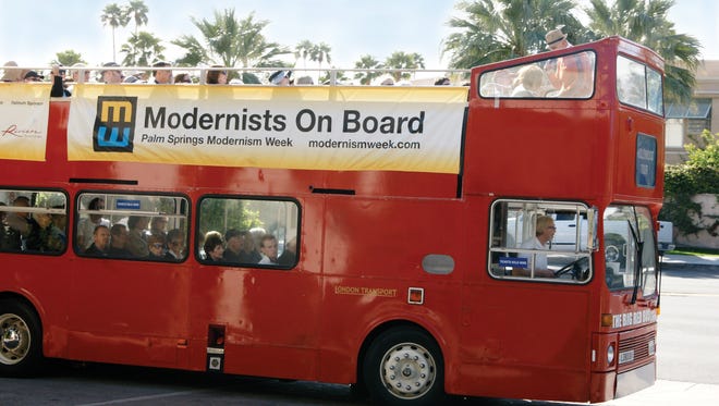A Modernism Week double-decker bus hits the road in 2014.