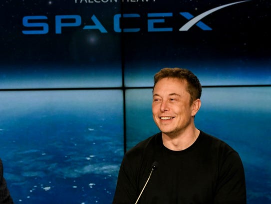 Elon Musk, CEO of SpaceX, answers questions during