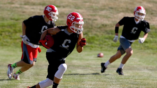 Central Panthers H-back Isaiah Abraham (22) with the ball during practice Monday, Aug. 17, 2015, in Independence.