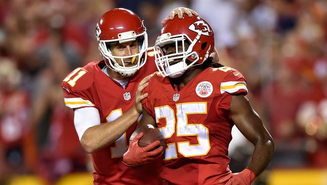 Chiefs quarterback Alex Smith celebrates with running back Jamaal Charles during their Week 2 game against the Broncos.