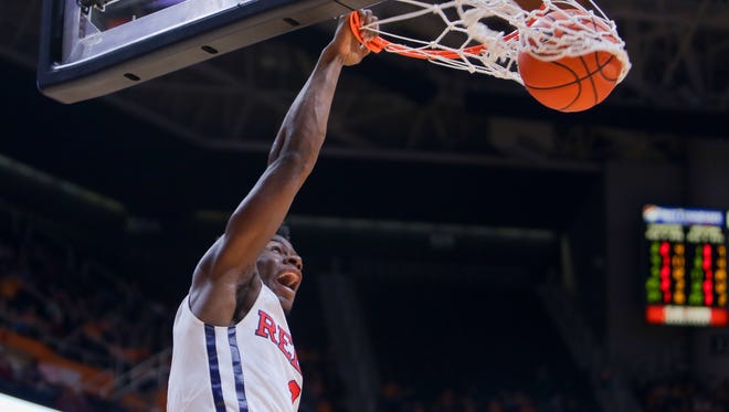 Guard Terence Davis (3) dunks the ball against the Tennessee Volunteers during the second half at Thompson-Boling Arena. The Rebels won 83-60.