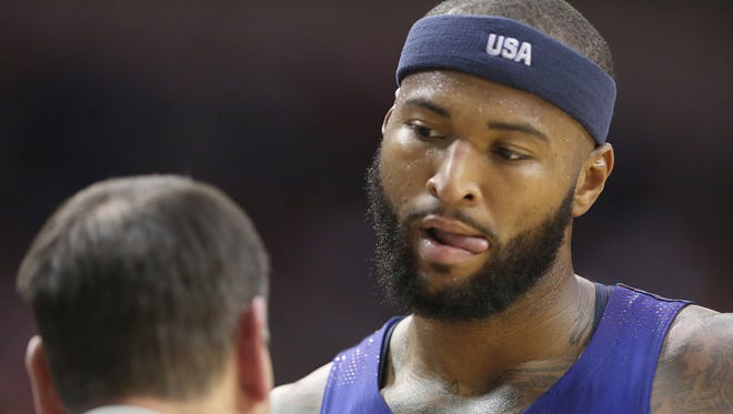 United States center Demarcus Cousins (12) talks with head coach Mike Krzyzewski while his team plays against Nigeria in the second quarter during an exhibition basketball game  at Toyota Center. United States won 110-66 on Aug. 1, 2016, in Houston.