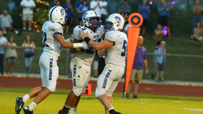 Bishop Chatard's Daylen Taylor (middle) celebrates during his team's 35-7 victory over Guerin Catholic on Friday. Taylor finished with 22 rushes for 103 yards and two touchdowns, and tacked on a 3-yard receiving touchdown.