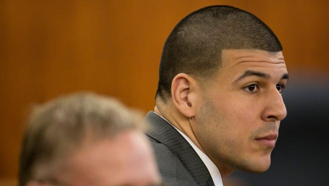 Former New England Patriots player Aaron Hernandez listens during his murder trial at the Bristol County Superior Court in Fall River, Mass., on Wednesday.
