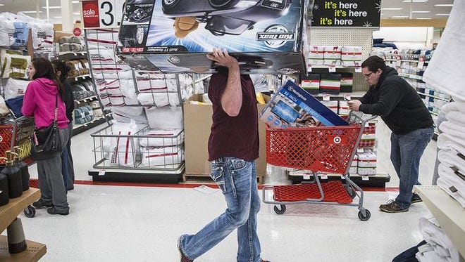 Shoppers take advantage of Black Friday deals on Thanksgiving at Target.
