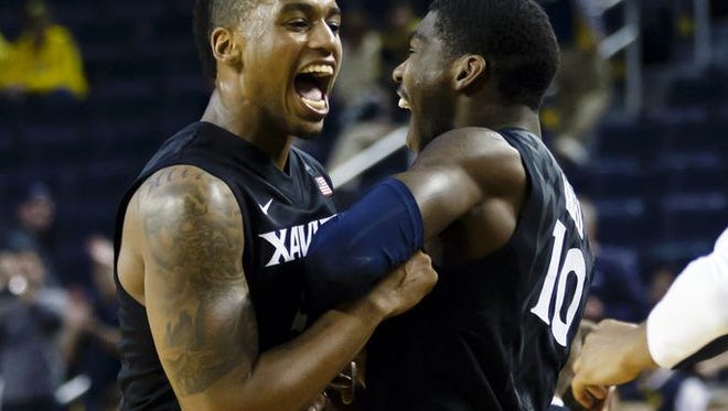 Xavier made waves as early as November when it upset No. 24 Michigan in Ann Arbor. Here, Trevon Bluiett and Remy Abell celebrate the 86-70 victory.