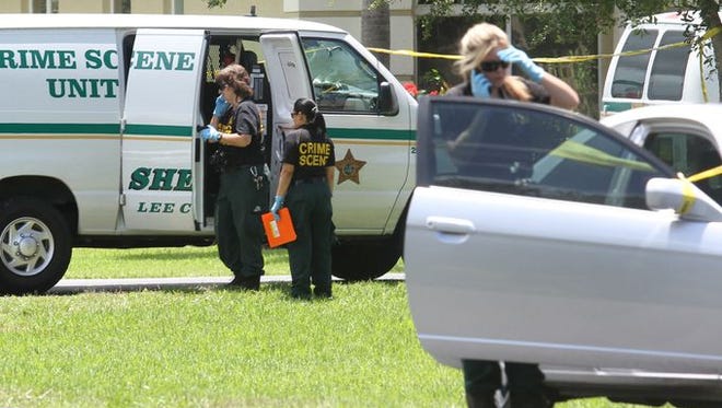 Members of the Lee County Sheriff's Office work the scene where two members of the Naples Police Department, Amy E. Young, 40, and Luis Monroig, 37, were shot in a domestic dispute at their home in Estero.