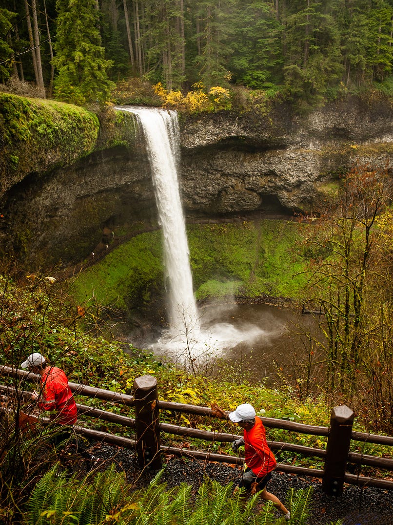 Runners pass the South Falls at Silver Falls State Park during the Silver Falls Trail Runs in 2013.