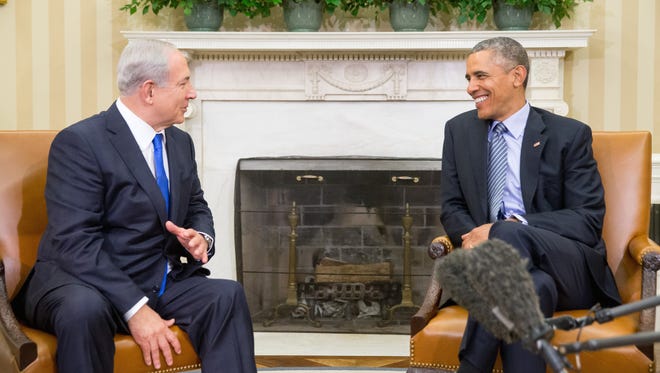 President Barack Obama meets with Israeli Prime Minister Benjamin Netanyahu in the Oval Office of the White House in Washington, Monday, Nov. 9, 2015. The president and prime minister sought to mend their fractured relationship during their meeting, the first time they have talked face to face in more than a year.