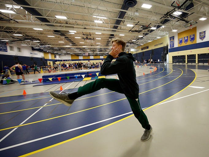 Wauwatosa West's Ean Haller warms up before the start